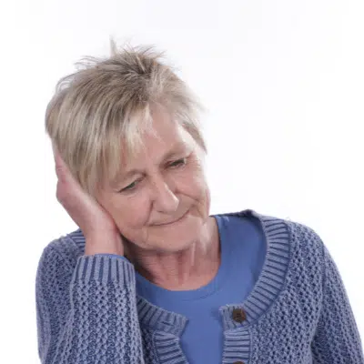 Elderly woman holding ear