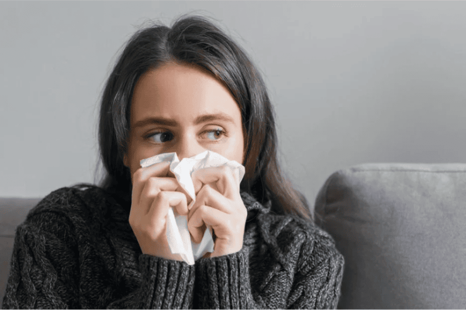 A person blowing her nose into a tissue AI-generated content may be incorrect (1) Woman blowing nose with tissue due to weather-related sinus congestion and sinus pressure symptoms